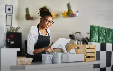 A retail employee easily navigating a user-friendly interface with Retail POS System Features.